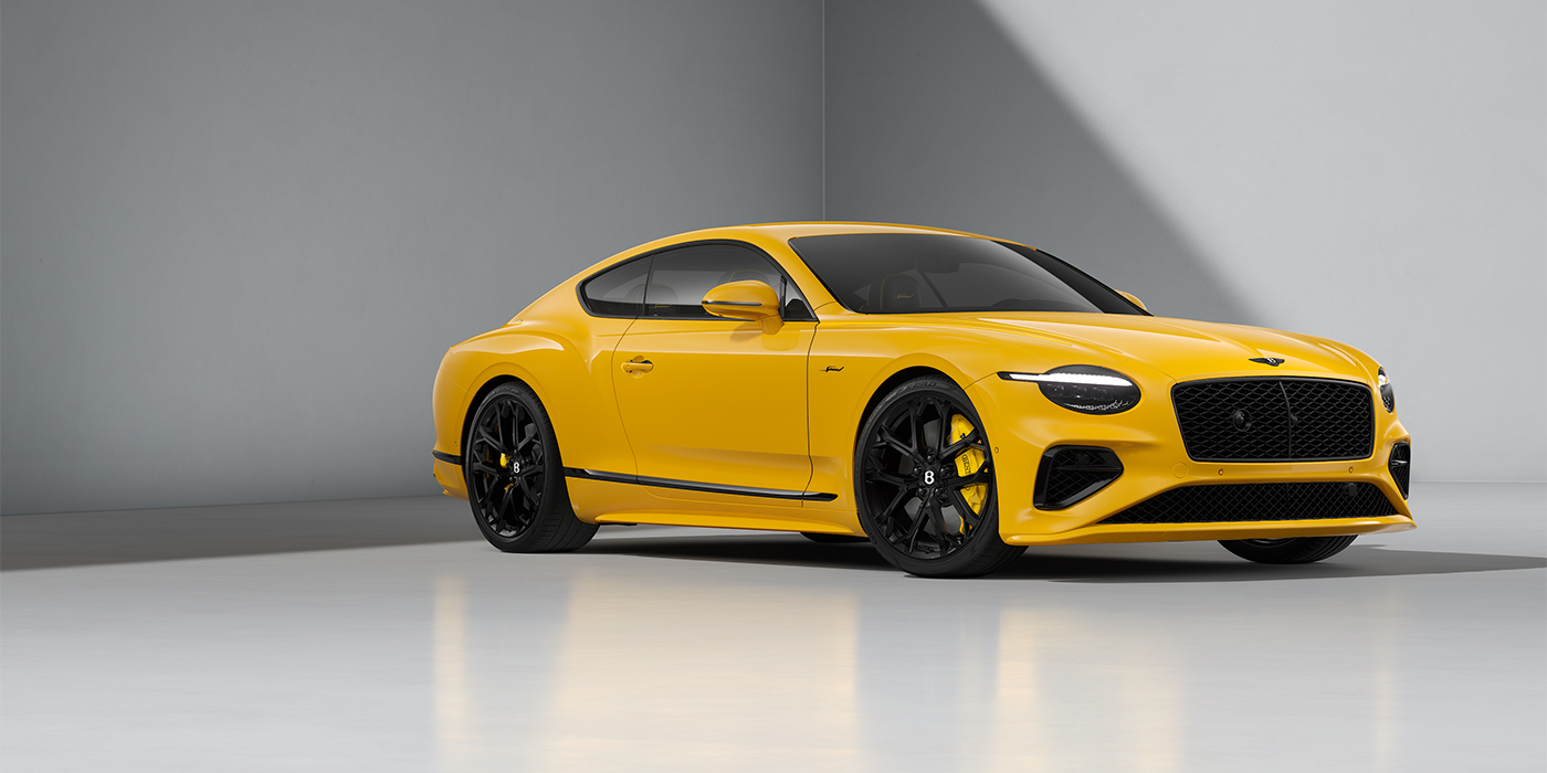 Bentley Mannheim Bentley Continental GT Speed coupe in Monaco Yellow paint and 22" Ten spoke sport wheels - front 3/4