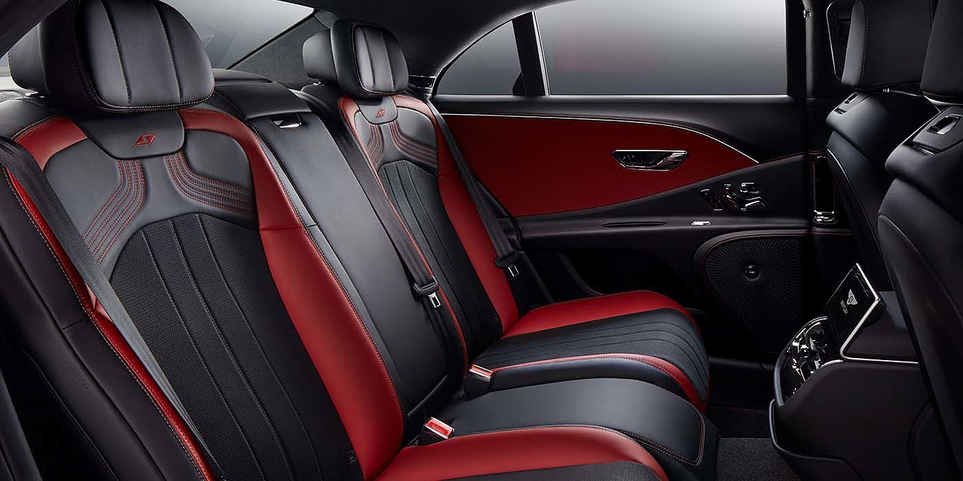 Bach Premium Cars GmbH | Bentley Mannheim Bentley Flying Spur S sedan rear interior in Beluga black and Hotspur red hide with S stitching