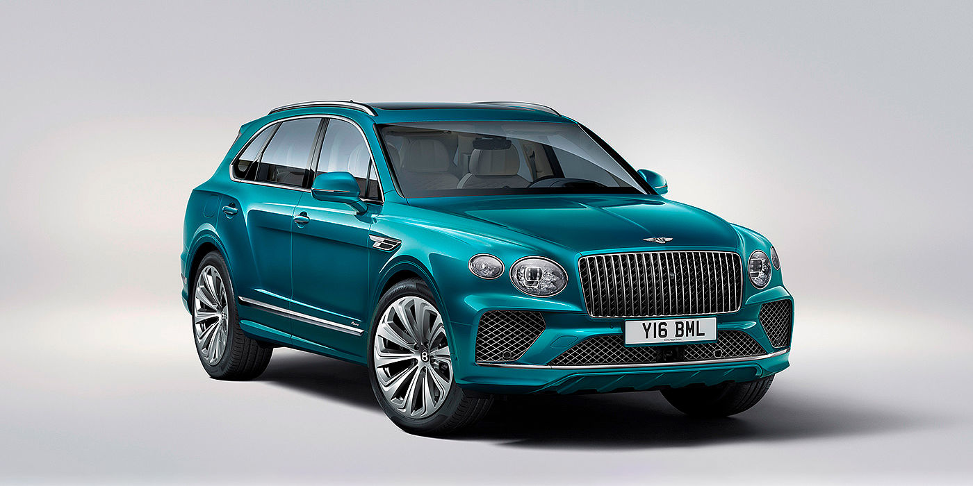 Bach Premium Cars GmbH | Bentley Mannheim Bentley Bentayga Azure front three-quarter view, featuring a fluted chrome grille with a matrix lower grille and chrome accents in Topaz blue paint.