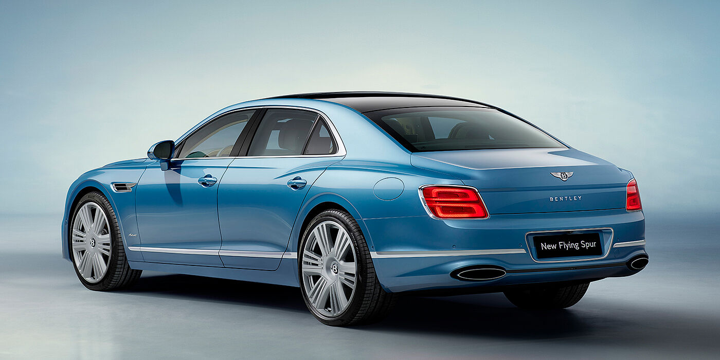 Bach Premium Cars GmbH | Bentley Mannheim New Bentley Flying Spur Azure sedan rear view in Light windsor blue by Mulliner paint with 22 inch Azure wheels and chrome exterior details