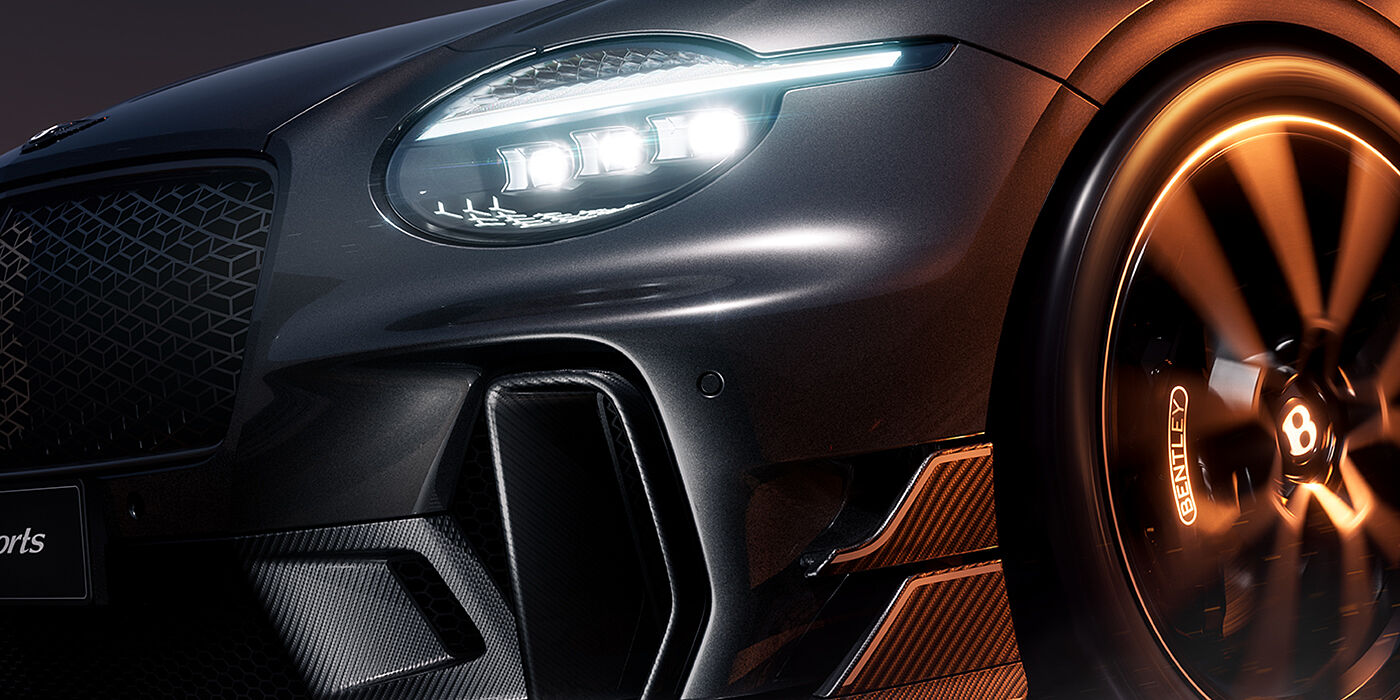 Bach Premium Cars GmbH | Bentley Mannheim Bentley Supersports front three quarter headlamp and lower grille detail in "Nightfall" design theme with Anthracite paint, Camel accents and Camel and Beluga Black striping