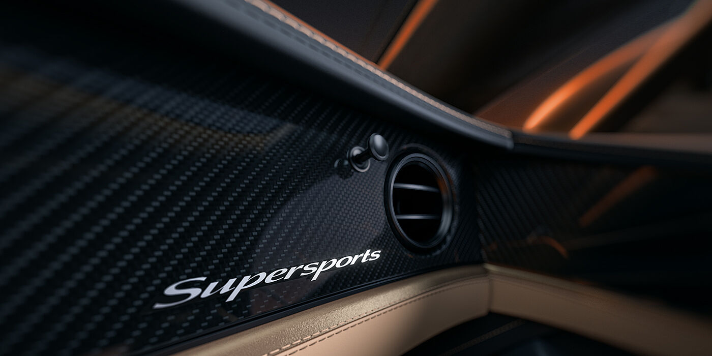 Bach Premium Cars GmbH | Bentley Mannheim Bentley Supersports front interior high gloss black carbon fibre veneer detail with Supersports badge