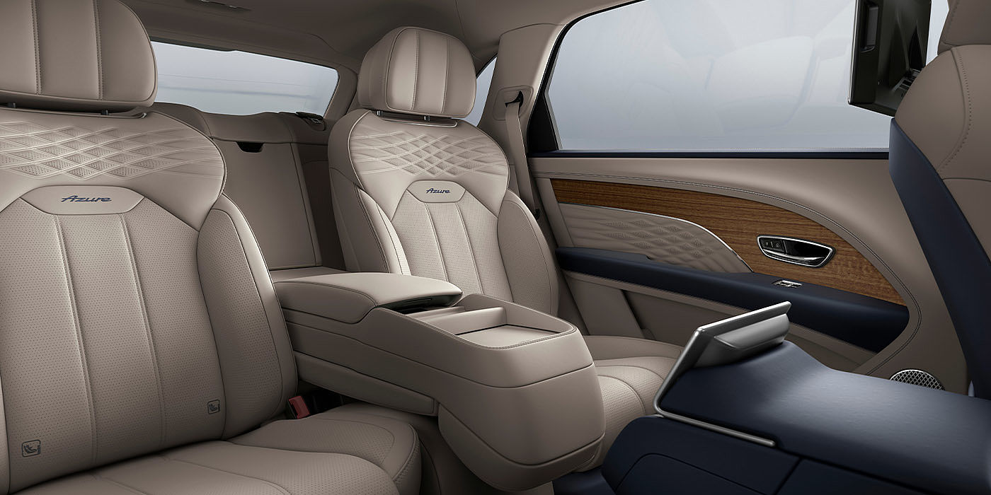 Bach Premium Cars GmbH | Bentley Mannheim Bentley Bentayga EWB Azure interior view for rear passengers with Portland hide featuring Azure Emblem in Imperial Blue contrast stitch.