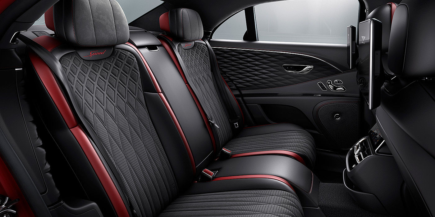 Bach Premium Cars GmbH | Bentley Mannheim Bentley Flying Spur Speed sedan rear interior in Beluga black and Cricket Ball red hide