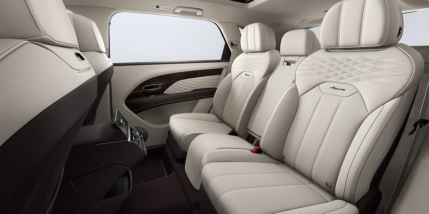 Bentley Mannheim Bentley Bentayga EWB Azure SUV rear interior in Linen and Burnt Oak hides and Azure seat stitching