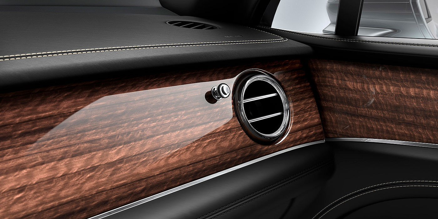 Bach Premium Cars GmbH | Bentley Mannheim Bentley Bentayga front interior Crown Cut Walnut veneer and chrome air vent.