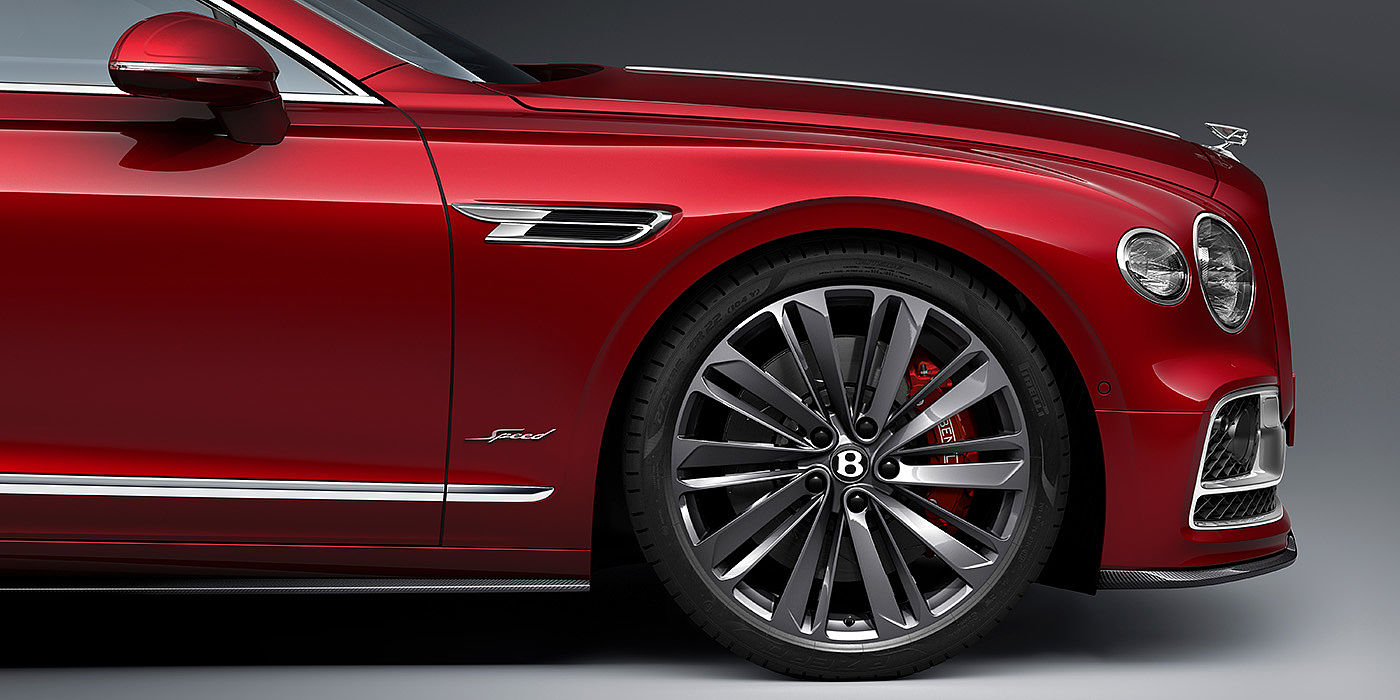 Bach Premium Cars GmbH | Bentley Mannheim Bentley Flying Spur Speed sedan front wheel in close up with Dragon Red II paint