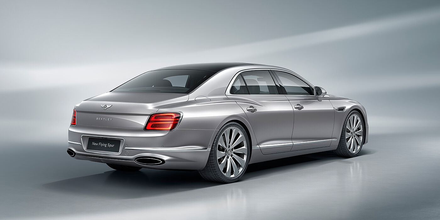 Bach Premium Cars GmbH | Bentley Mannheim New Bentley Flying Spur sedan rear view in Silverlake paint with ten spoke wheels and chrome matrix grille