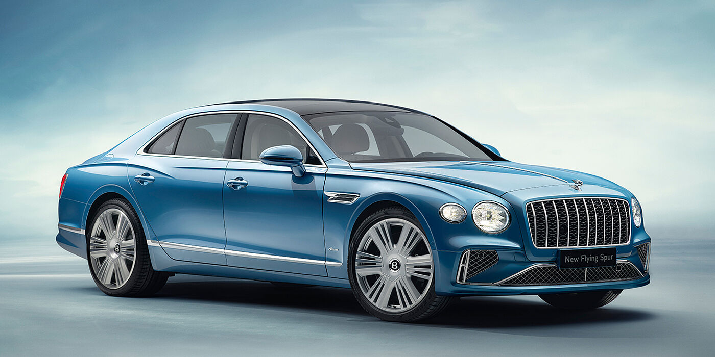Bach Premium Cars GmbH | Bentley Mannheim New Bentley Flying Spur Azure sedan front view in Light windsor blue by Mulliner paint with 22 inch Azure wheels and chrome exterior details