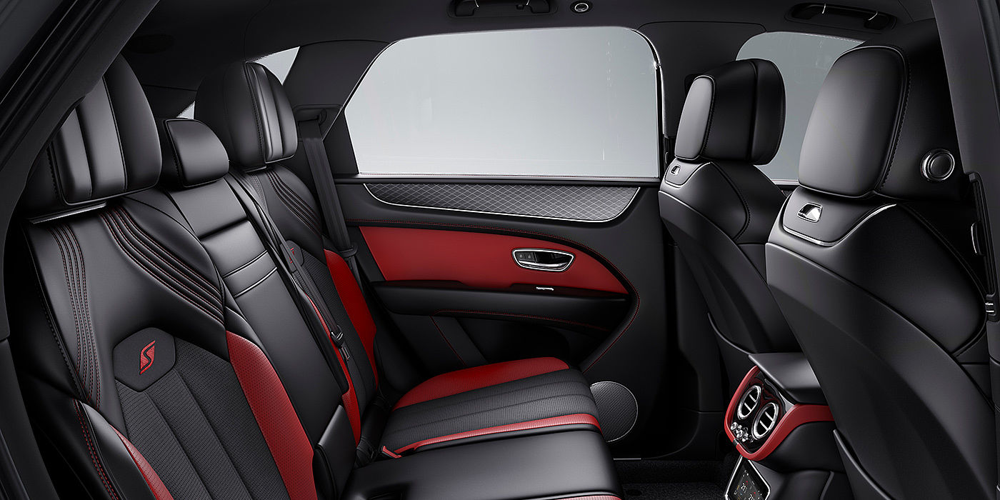 Bach Premium Cars GmbH | Bentley Mannheim Bentey Bentayga S interior view for rear passengers with Beluga black and Hotspur red coloured hide.