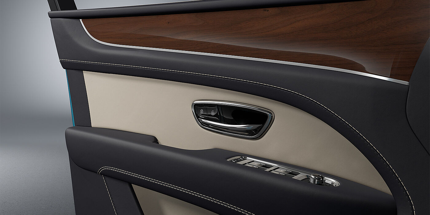 Bentley Mannheim Bentley Bentayga EWB SUV door interior detail in Portland and Imperial Blue hides with Crown Cut Walnut veneer