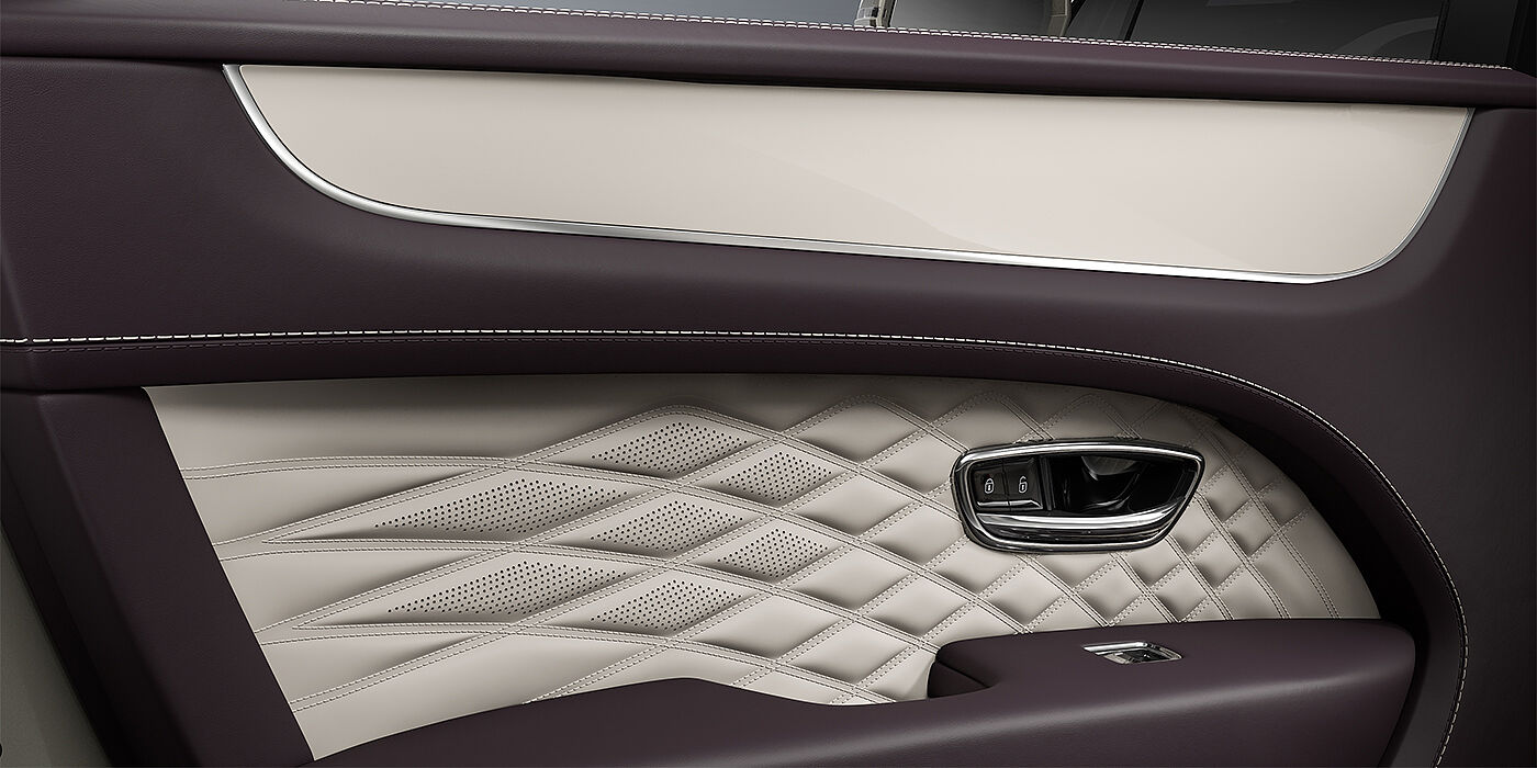 Bentley Mannheim Bentley Bentayga EWB Azure SUV door interior detail in Linen and Damson hides with Piano Linen veneer