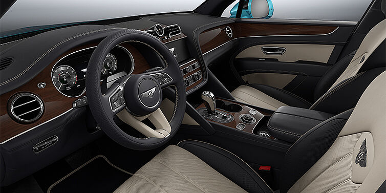 Bentley Mannheim Bentley Bentayga EWB SUV front interior in Portland and Imperial Blue hides with Crown Cut Walnut veneer