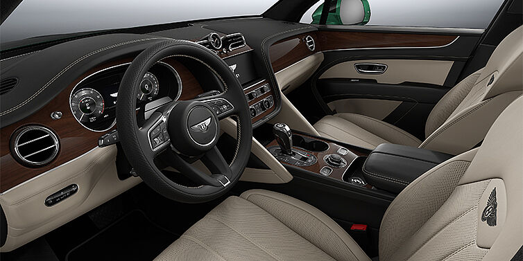 Bentley Mannheim Bentley Bentayga SUV front interior in Portland and Beluga black hides with Crown Cut Walnut veneer