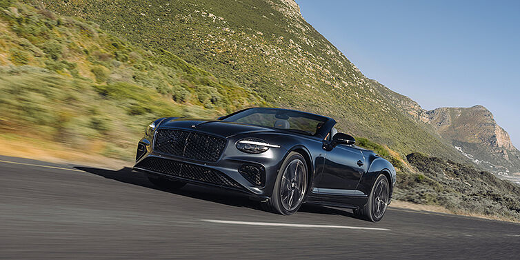 Bach Premium Cars GmbH | Bentley Mannheim Bentley Continental GTC S Cabrio in Thunder Lackierung, 3/4-Ansicht von vorne, fahrend auf Bergstraße