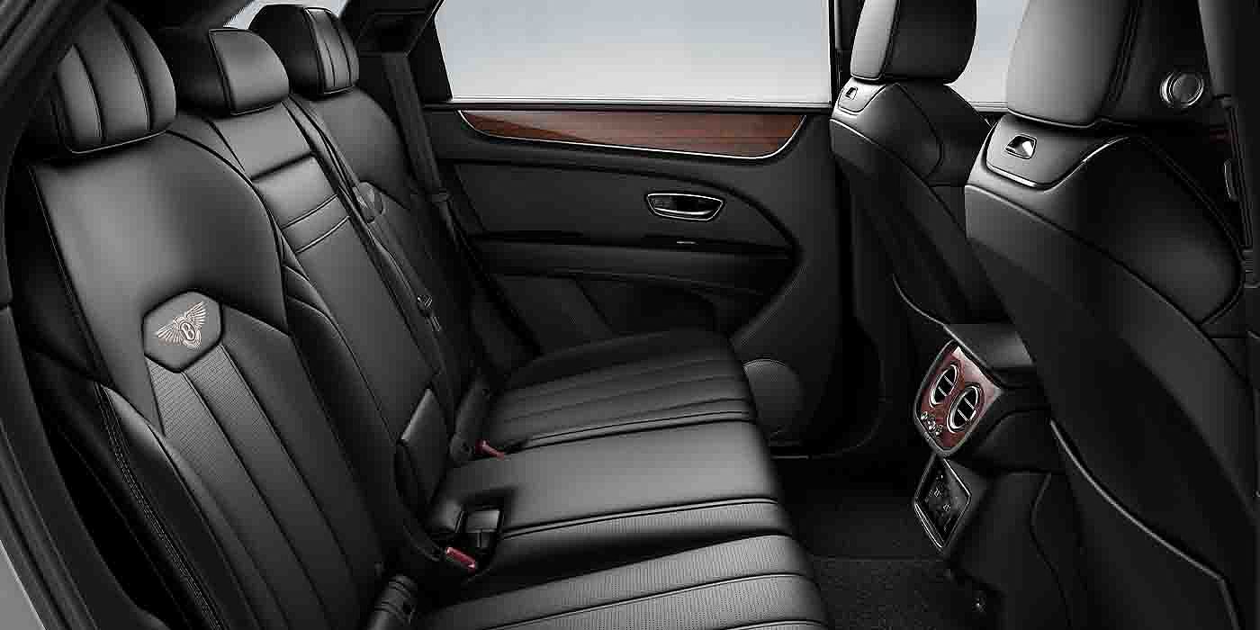 Bach Premium Cars GmbH | Bentley Mannheim Bentley Bentayga EWB interior view for rear passengers with Beluga black hide.