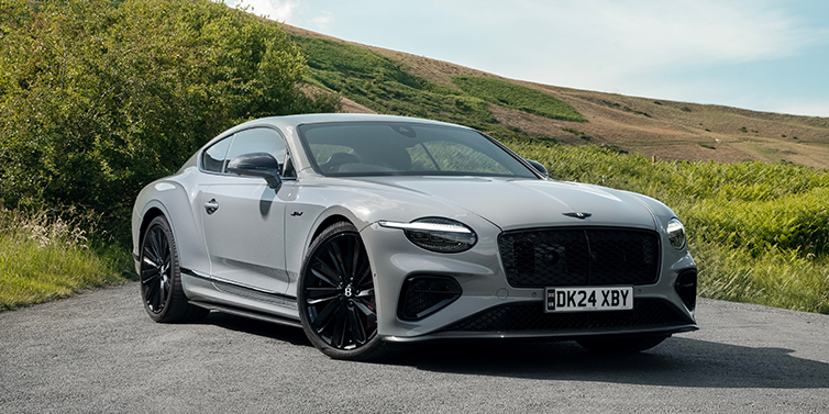 Bach Premium Cars GmbH | Bentley Mannheim Bentley Continental GT front three quarter with Carbon Fibre Specification parked on road.