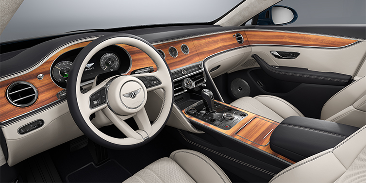 Bentley Mannheim New Bentley Flying Spur sedan front interior in Linen and Imperial Blue hides with Open PoreKoa veneer