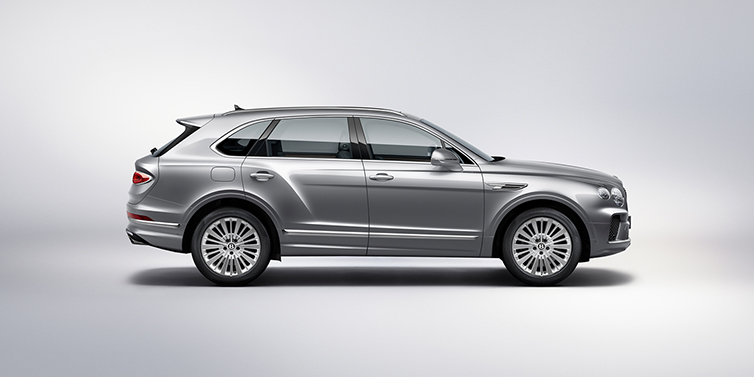 Bach Premium Cars GmbH | Bentley Mannheim Bentley Bentayga SUV side profile in Moonbeam silver paint against white background featuring 21 inch 5 spoke wheels