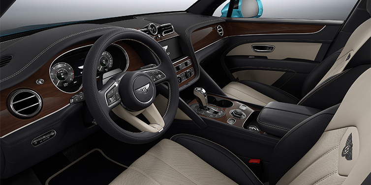Bentley Mannheim Bentley Bentayga EWB SUV front interior in Portland and Imperial Blue hides with Crown Cut Walnut veneer