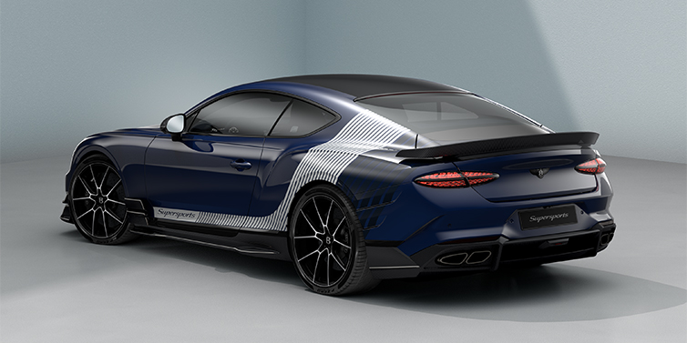 Bach Premium Cars GmbH | Bentley Mannheim Bentley Supersports rear three quarter in "Skies" Design theme with Electric Blue paint finish and Arctica white and Oxford blue paint stripes across the rear haunch.