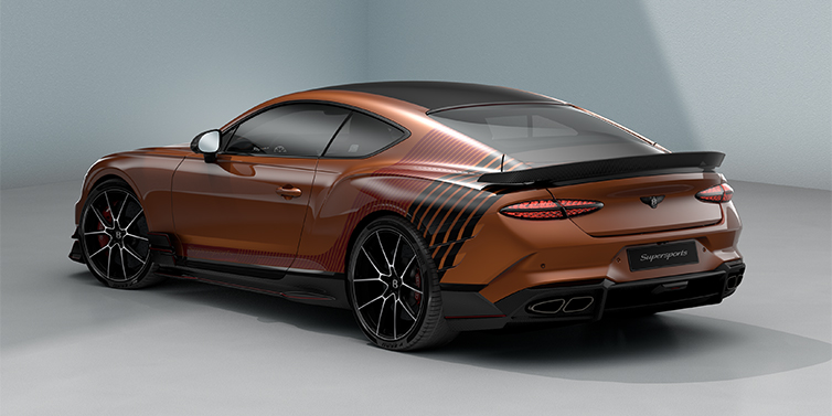 Bach Premium Cars GmbH | Bentley Mannheim Bentley Supersports rear three quarter in "Meteorite" Design theme with Orange Flame paint and Beluga Black and Candy Red paint stripes across the rear haunch.