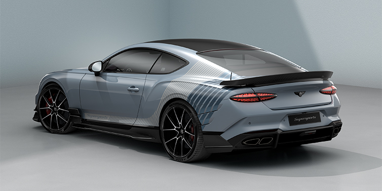 Bach Premium Cars GmbH | Bentley Mannheim Bentley Supersports rear three quarter in "Daybreak" Design theme with Jetstream blue paint and Arctica white and Portofino blue paint stripes across the rear haunch.