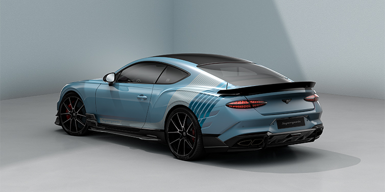 Bach Premium Cars GmbH | Bentley Mannheim Bentley Supersports rear three quarter in "Daybreak" Design theme with Jetstream blue paint and Arctica white and Portofino blue paint stripes across the rear haunch.